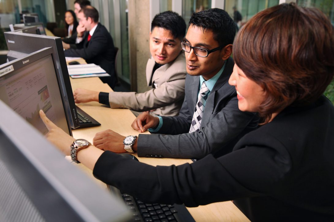 students working together on a computer