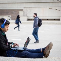 student studying on campus