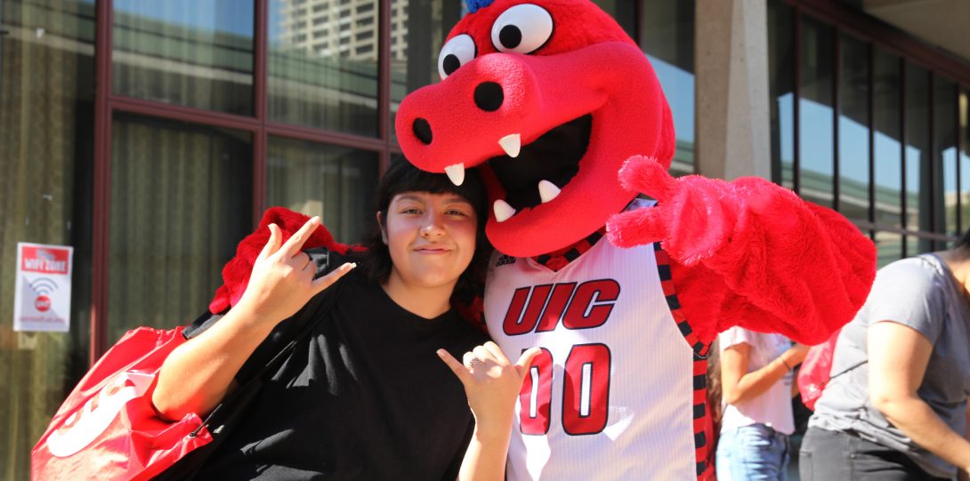A student giving Pose with Sparky