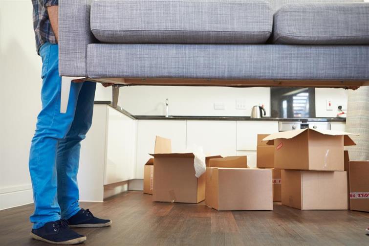 Movers lifting a couch